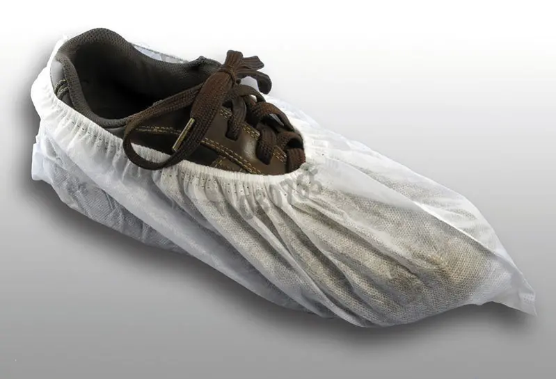 Couvre-chaussure en polypropylène blanc - avec semelle